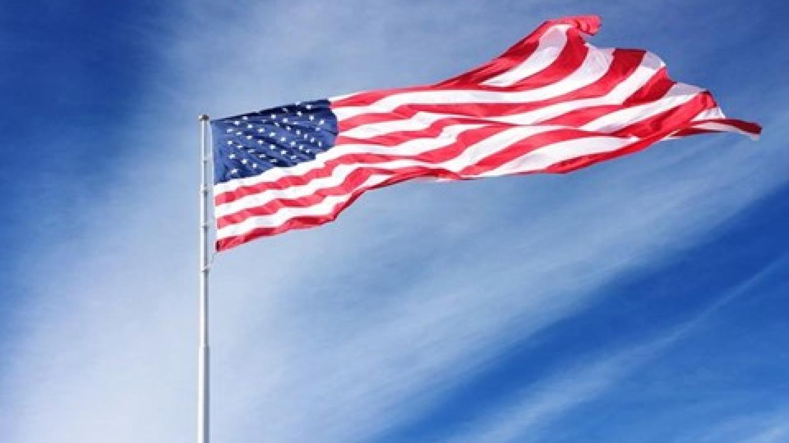 The flag of the United States waving in the wind.