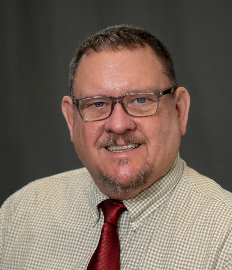 man smiles at camera