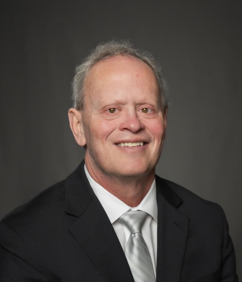 man smiles at camera