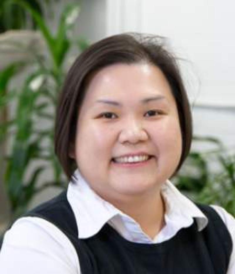 woman smiles at the camera