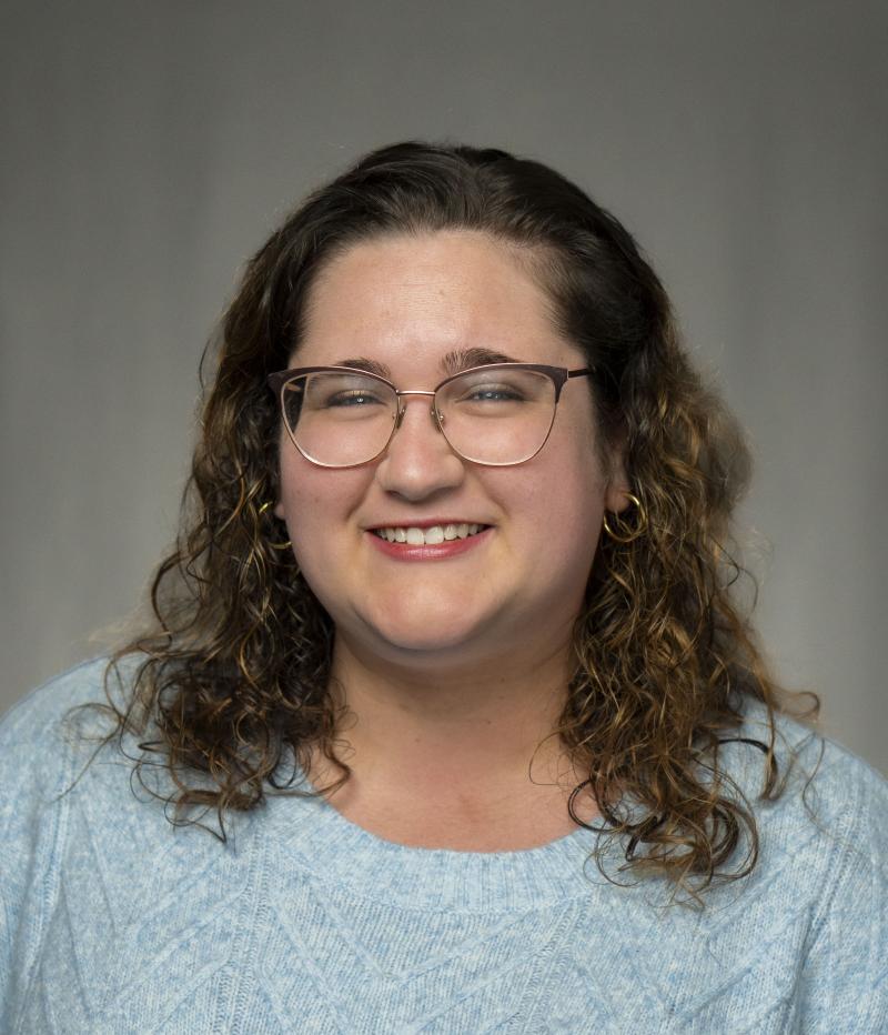 woman smiles at the camera