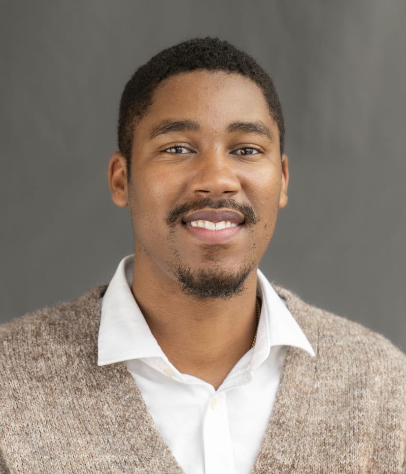 man smiles at camera
