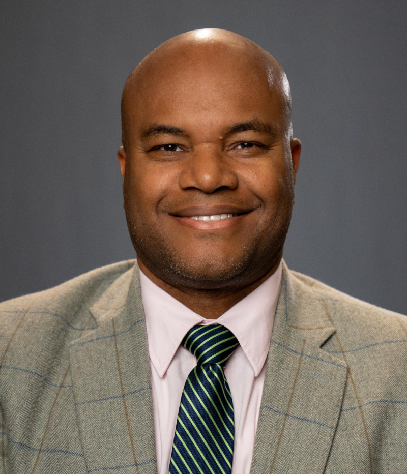 man smiles at camera