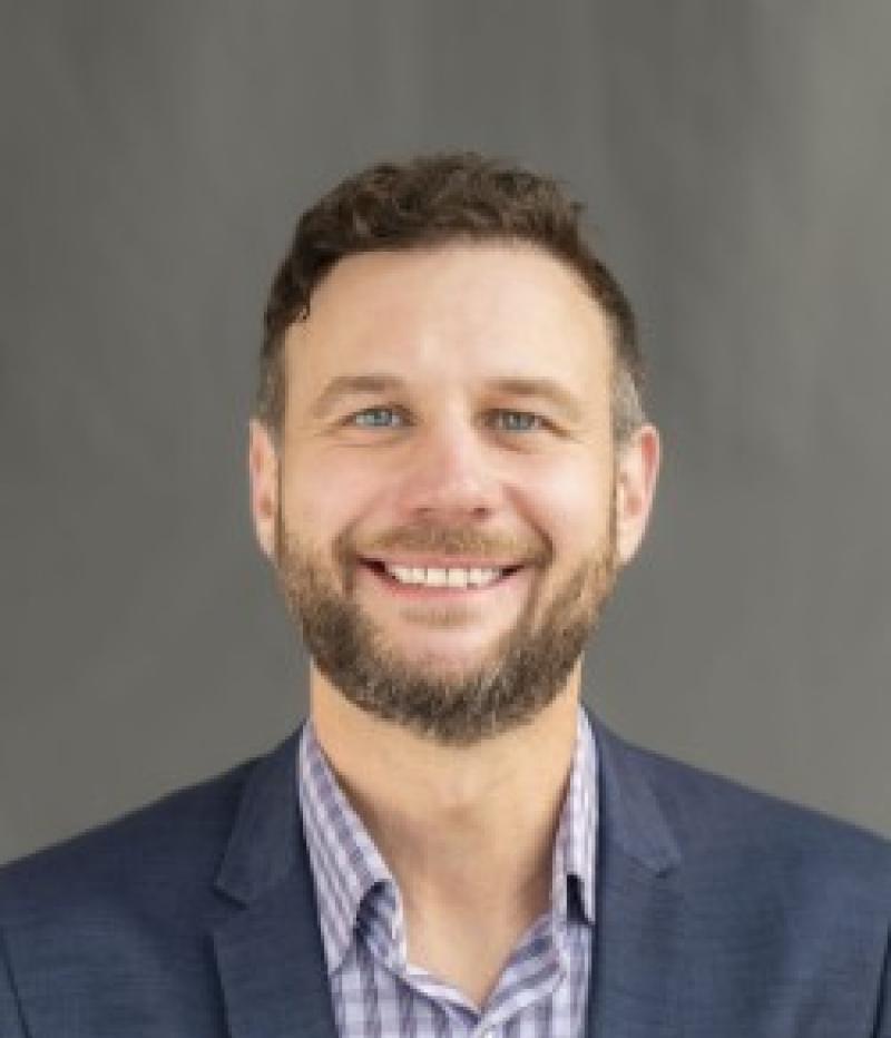 man smiles at camera