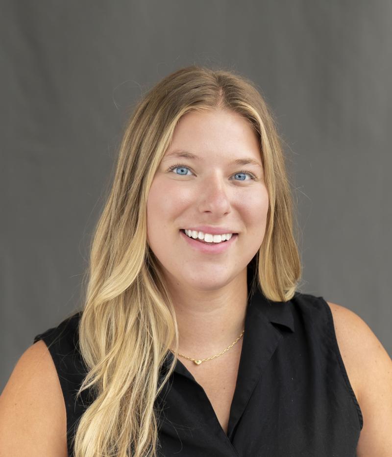 woman smiles at the camera