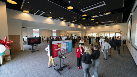 Research Day Poster Session, Wide of Room, People Speaking to Researchers