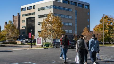 D'Youville University Students on a tour. D'Youville Academic Building is in the background.