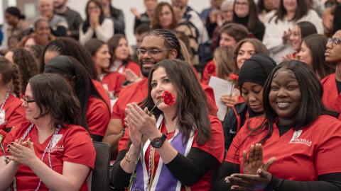 crowd of people clapping