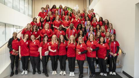 large group photo of nurses in scrubs