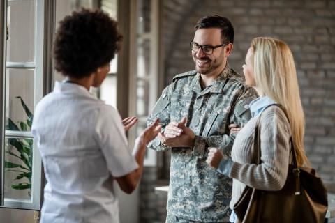 image of army soldier and his wife talking to Vet Admission Expert DYU 