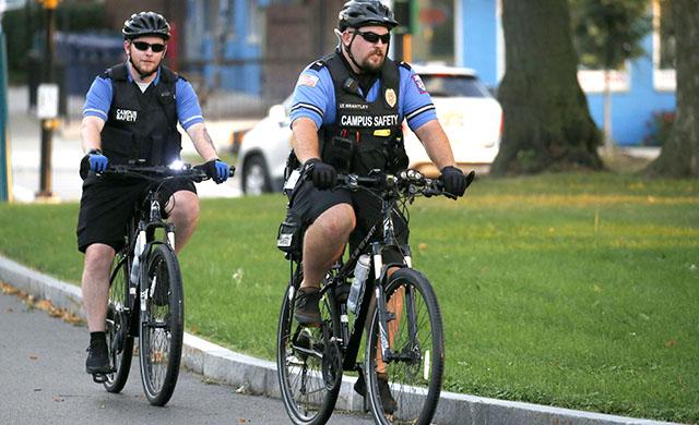 Campus Safety officers patrolling campus on bicycles.