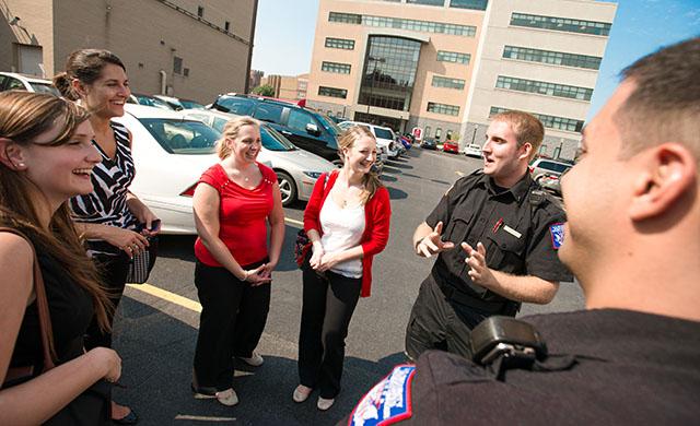Officers talking with members of the campus community.