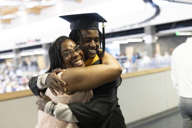 graduating student hugging parent