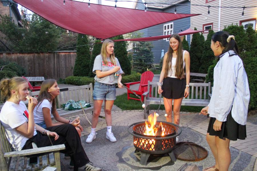Seminary students using the outside fire pits to make smores to relax after studies at DYU.