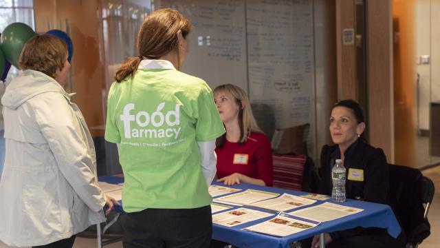 women with food farmacy shirt