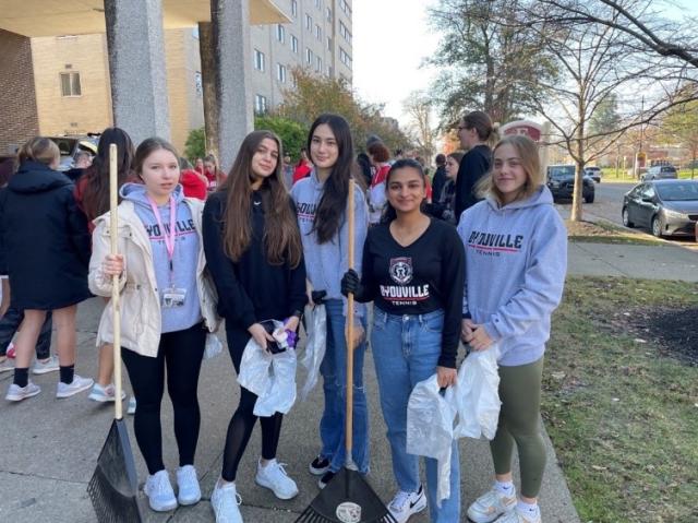 student athletes participating in community clean up