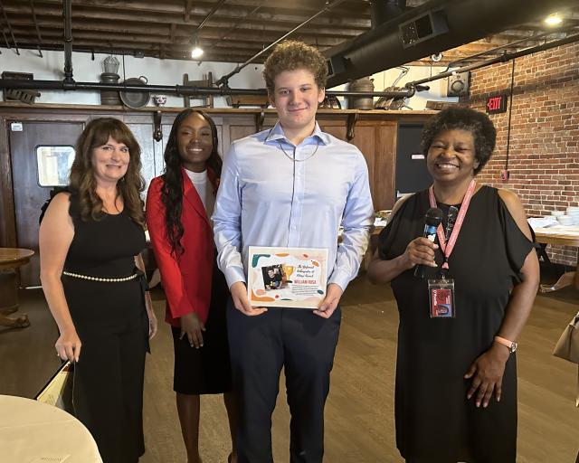 Student Receives Award at a dinner