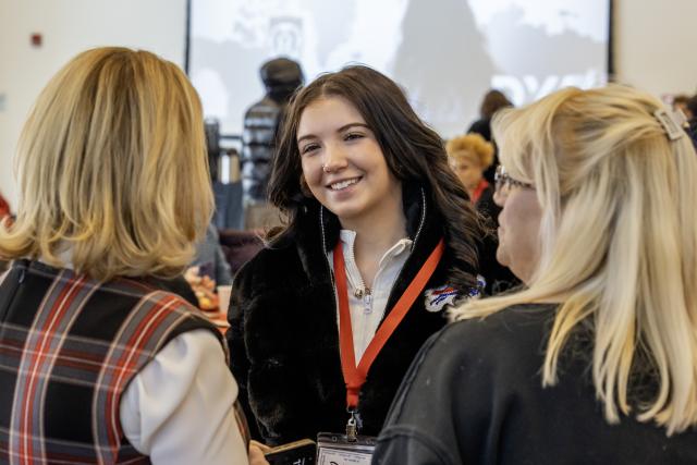 student smiles while talking
