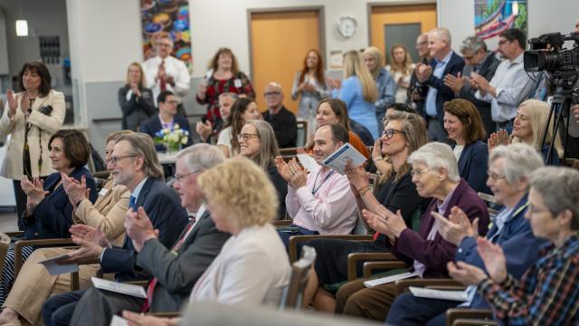 crowd of people clapping