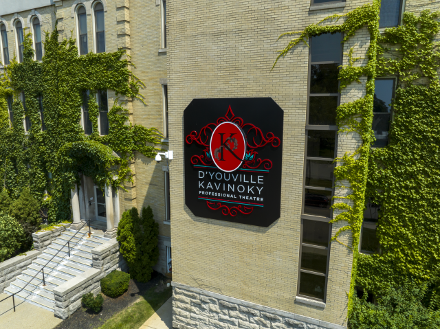 sign on the side of a building that reads D'Youville Kavinoky Professional Theatre