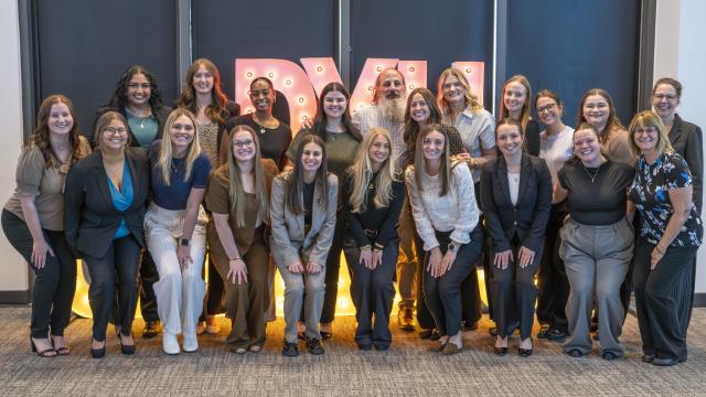 large group photo of people smiling at the camera