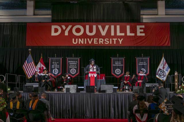 kimora parks stands at a podium on a large stage