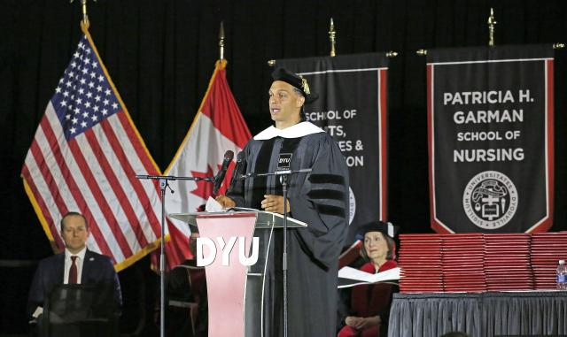 Mack Hollins standing at podium speaking