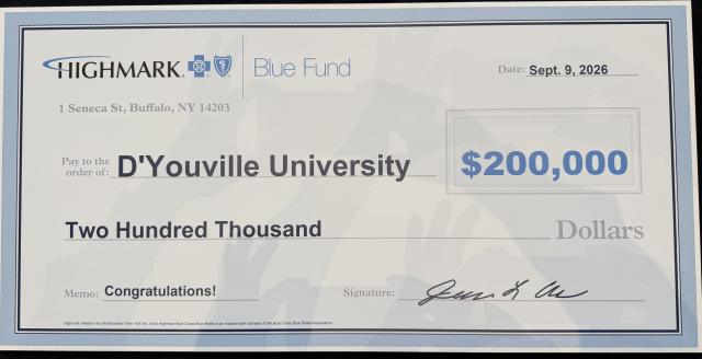 Image of a giant check awarding D'Youville two hundred thousand dollars for their Vital Pharmcy
