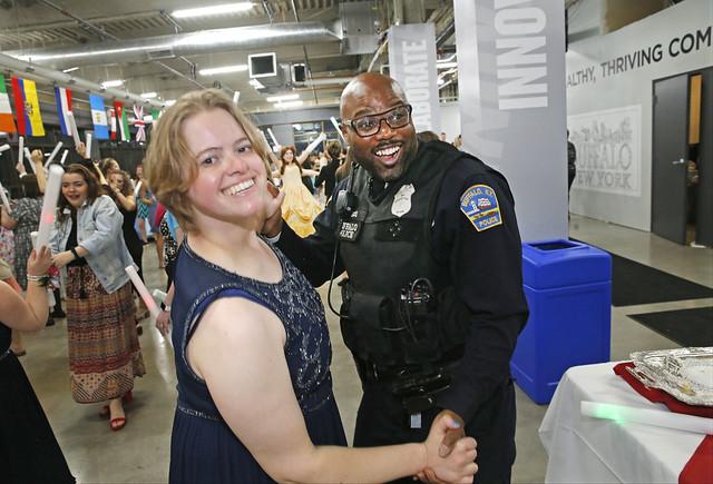 A student and a law enforcement officer dance at the "Once Upon a Time" prom.