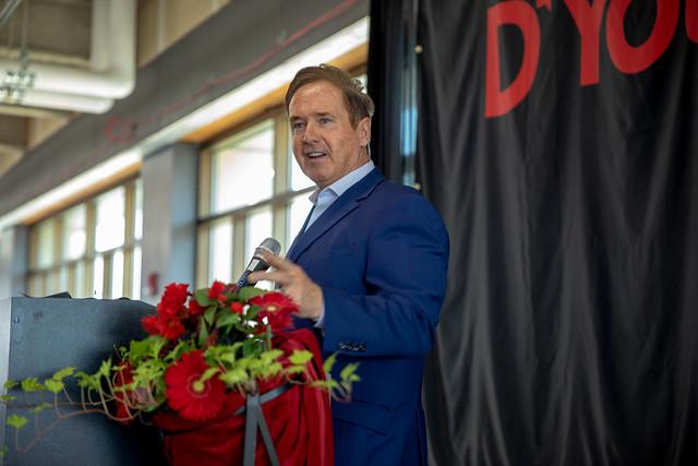 Congressman Brian Higgins announcing nursing grant from a podium