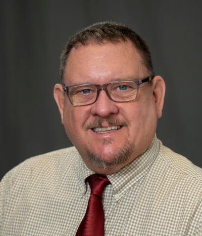 man smiles at camera