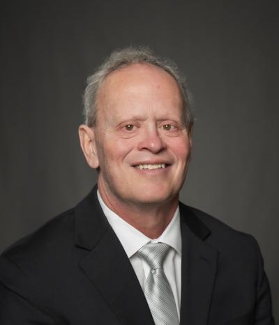 man smiles at camera