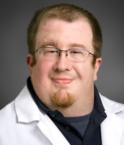 man smiles at camera
