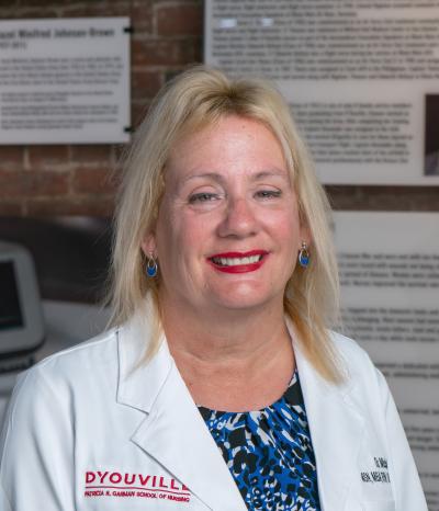 woman smiles at the camera