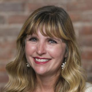 woman smiles at the camera