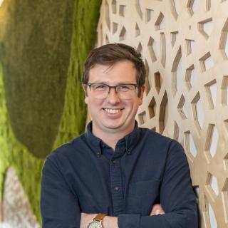 man smiles at camera