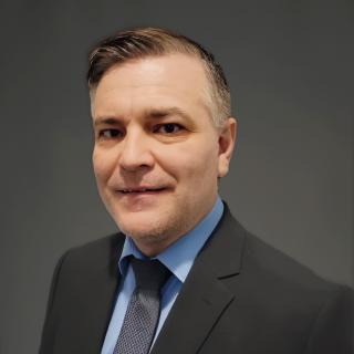 man smiles at camera